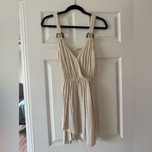 Cream Sleeveless Dress with Ring Accents